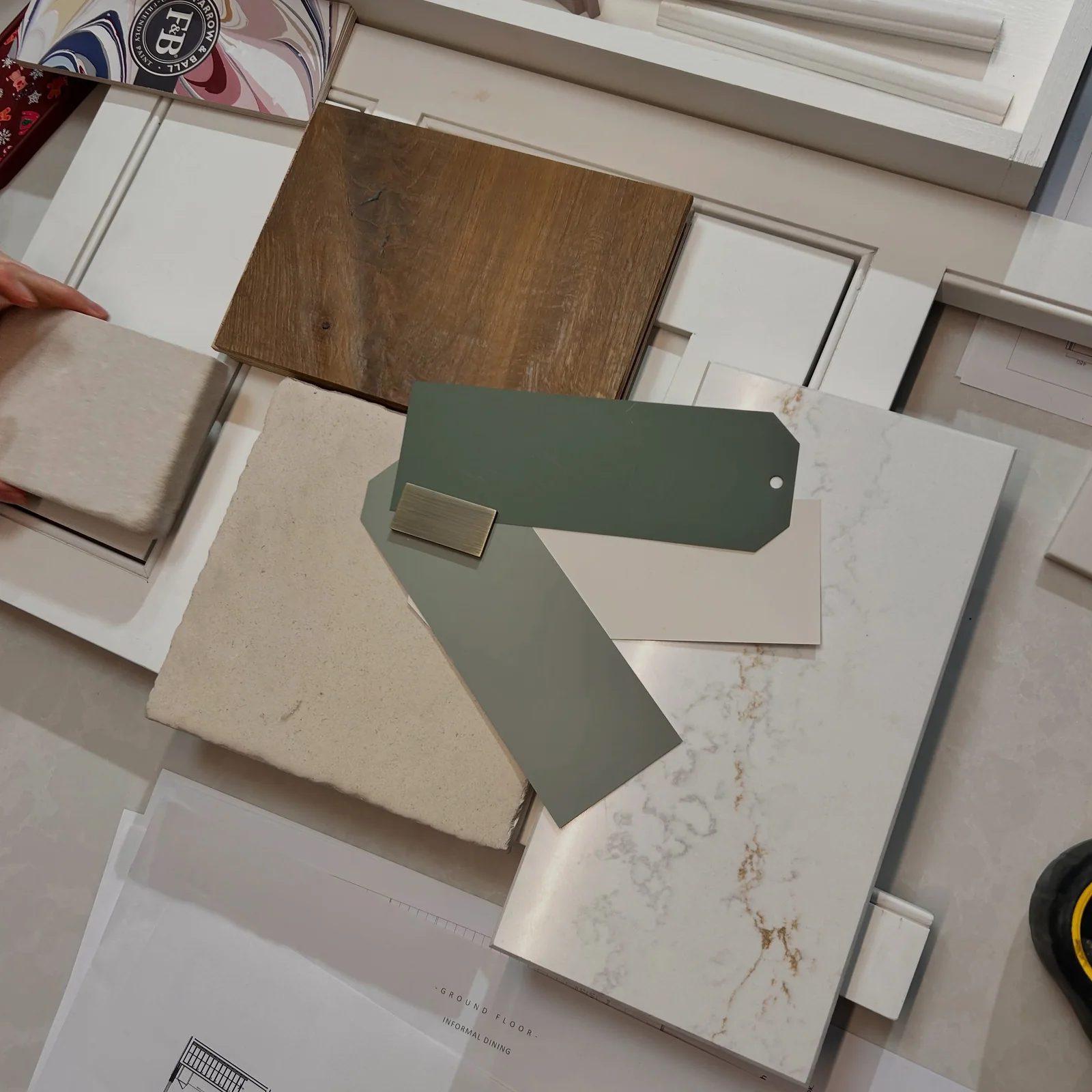 Timber, stone, paint and handle samples brought together for an Obsidian kitchen design