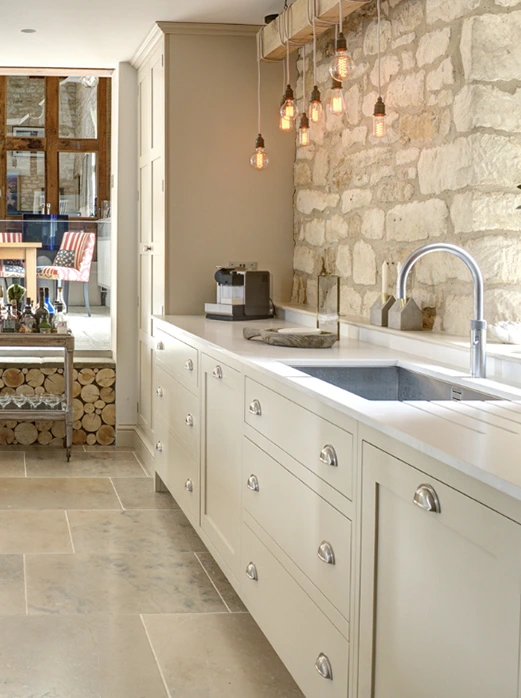 Country kitchen with exposed stone wall