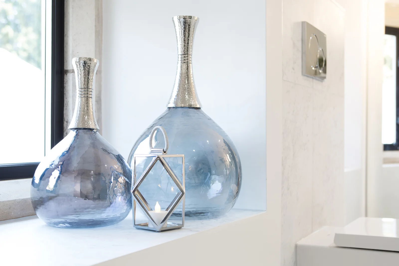 Blue glass accessories beside the en-suite window