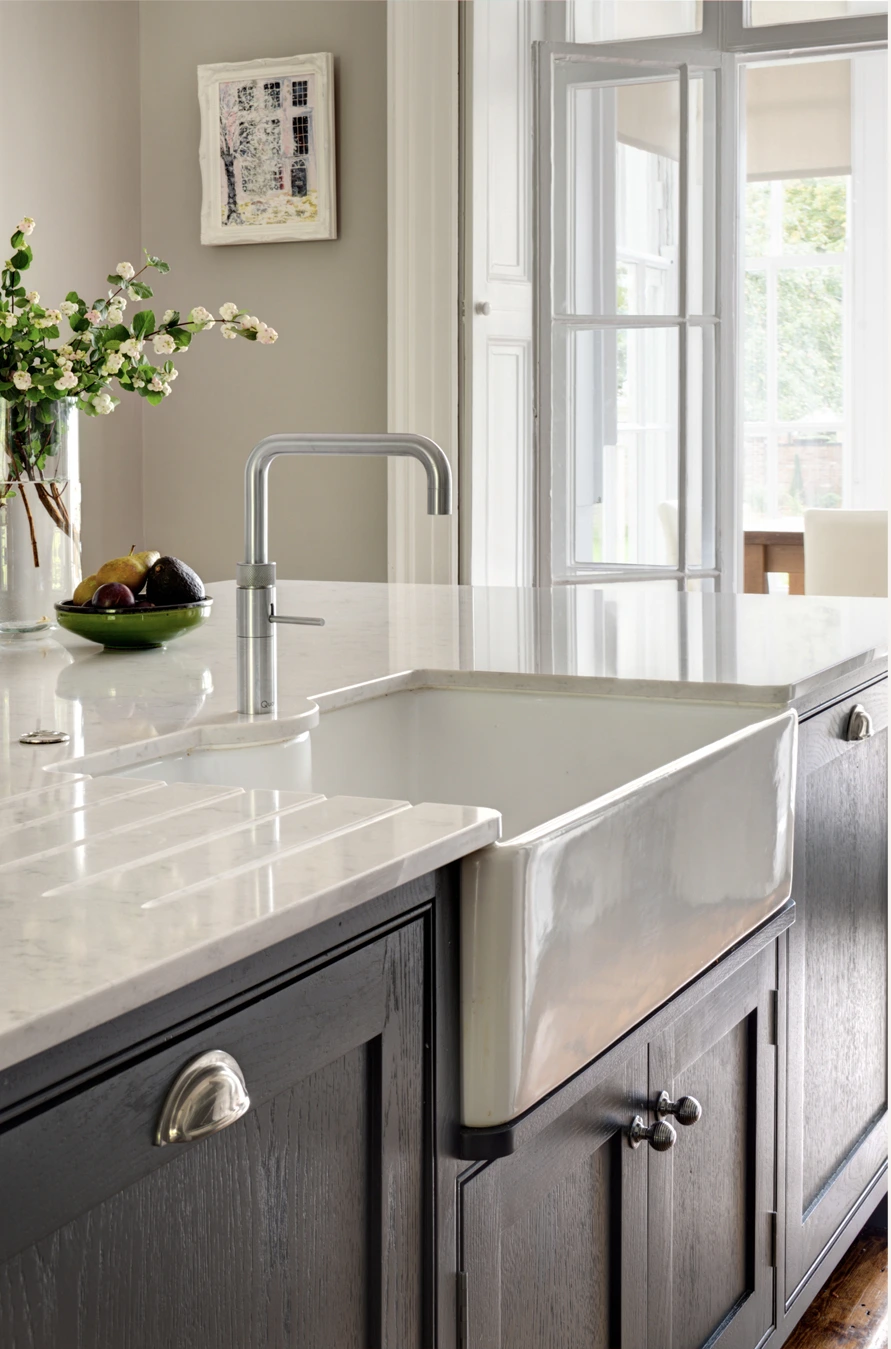 Belfast sink and polished stone worktop in Alison’s kitchen